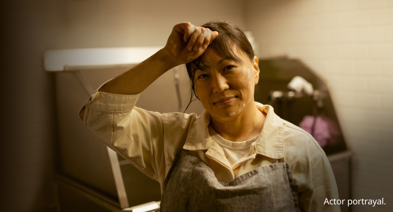 Woman wiping soap from her face